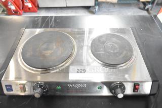 Waring WDB600 metal countertop 2 burner range, 120 volts, 1 phase. Visible wear, NSF certified, ready indicator lights.
