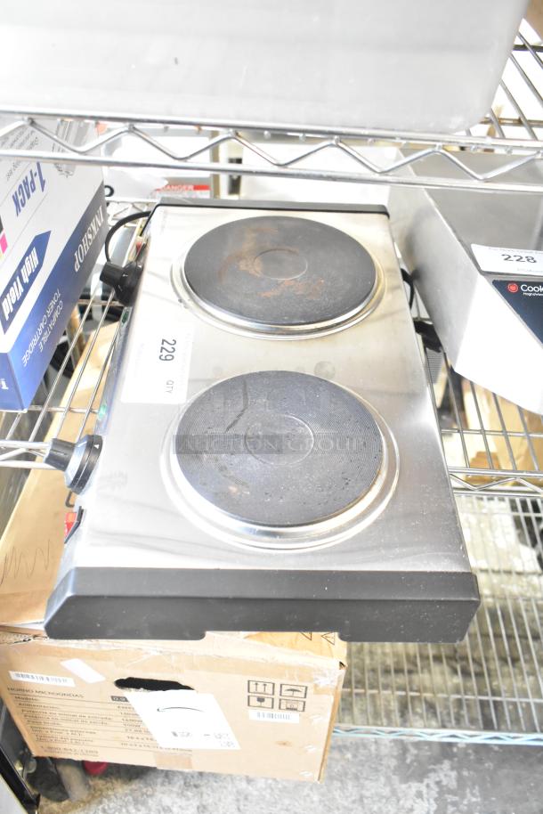 Waring WDB600 metal countertop 2 burner range, 120 volts, 1 phase, used condition, visible wear on burners.