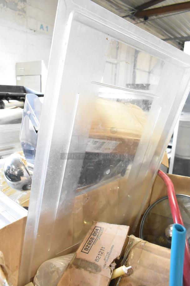 Tier lot featuring various items including a large poly bin, Kay hand sanitizer, and a glass lid. Items appear in used condition.