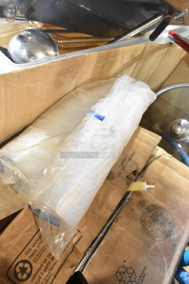 Tiered lot including poly bins, Kay hand sanitizer, glass lid; items in used condition with visible packaging.