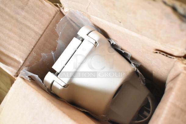 Boxed item with white plastic housing, possibly a poly bin or component. Visible wear on the packaging.