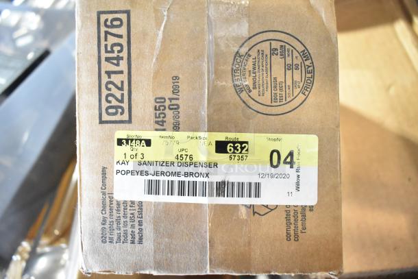 Cardboard box labeled "Kay Sanitizer Dispenser" with barcode and shipping details for Popeyes-Jerome-Bronx.