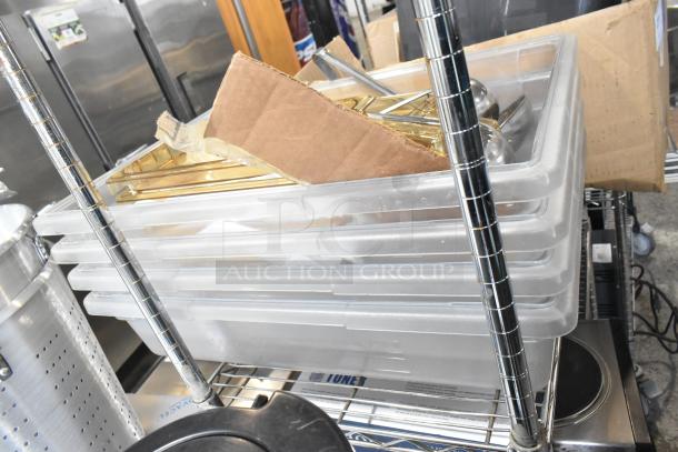 Tier lot of items featuring clear poly bins, cardboard, ladles, and glass lid on a metal shelf. Used condition.