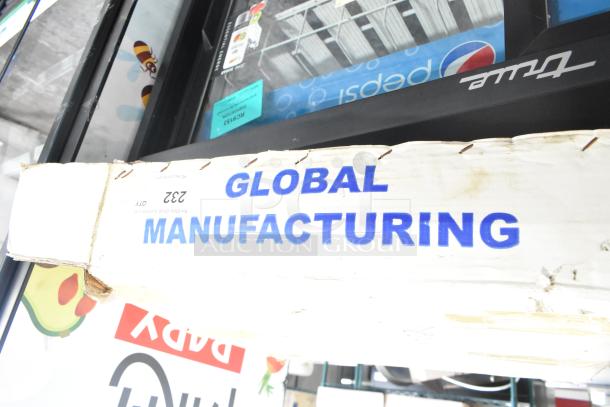 Cardboard box with "Global Manufacturing" text, containing EF-INTERLOCK Hose. Box shows minor wear, indicating package condition.