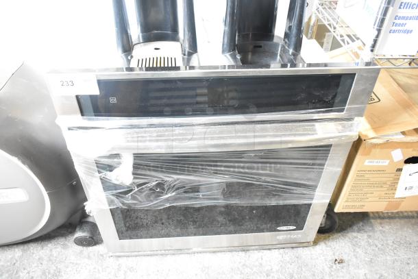 JennAir JJW2430DS01 stainless steel convection oven, electric powered, 208/240V. New, wrapped in plastic. Model visible on front.