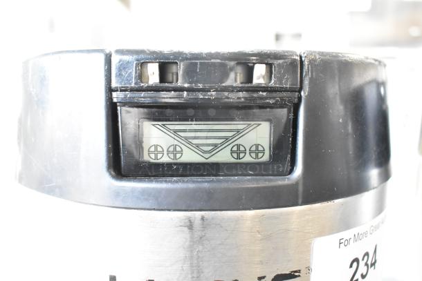 Two metal countertop beverage dispensers, featuring a digital display and marked with tag 234. Gently used condition.
