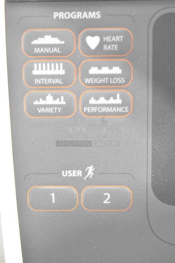 Precor elliptical control panel displaying program options: manual, heart rate, interval, weight loss, variety, performance, and user profiles 1 and 2.