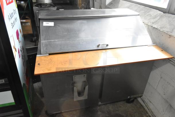 Beverage Air SPE48-18M stainless steel sandwich prep table, commercial casters, 115V, used condition, visible label.