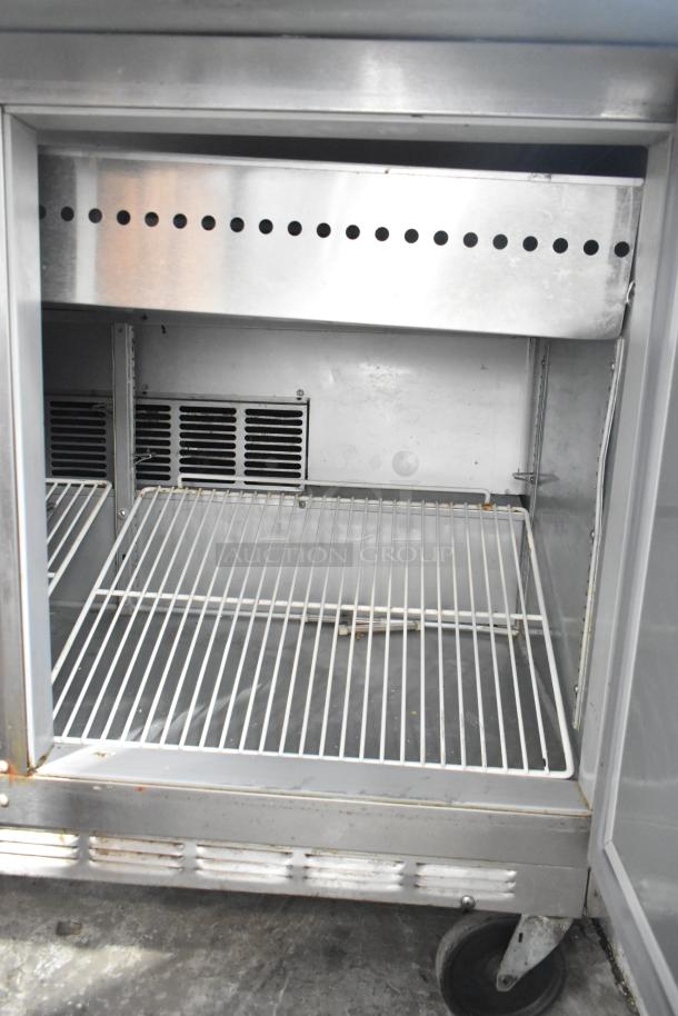 Beverage Air SPE48-18M stainless steel prep table, commercial casters, 115 volts, 1 phase, in good condition.