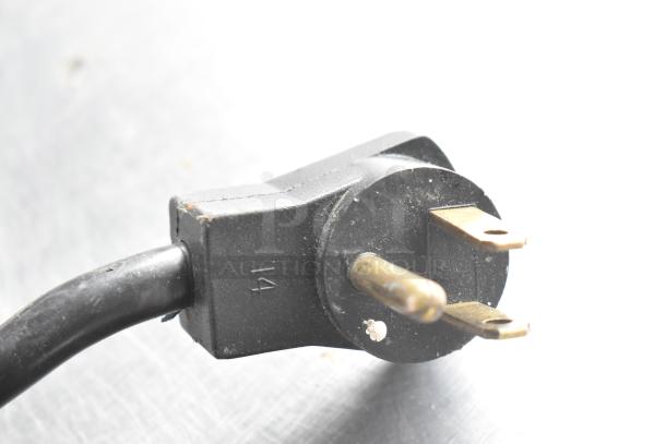 Black electrical plug for a Beverage Air SPE48-18M prep table, showing three prongs and part number "14."