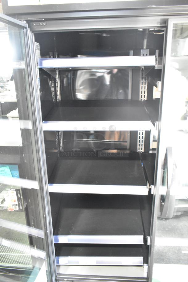 2024 True TVM-48SL-HC commercial 2-door reach-in cooler, metal shelves, 115V, 1 phase, excellent condition.