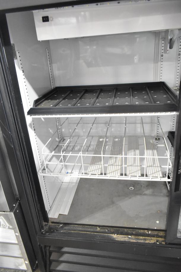 True GDM41SL48-HC-LD metal commercial 2-door cooler merchandiser with poly-coated racks, 115V, 1 phase. Clean used condition.