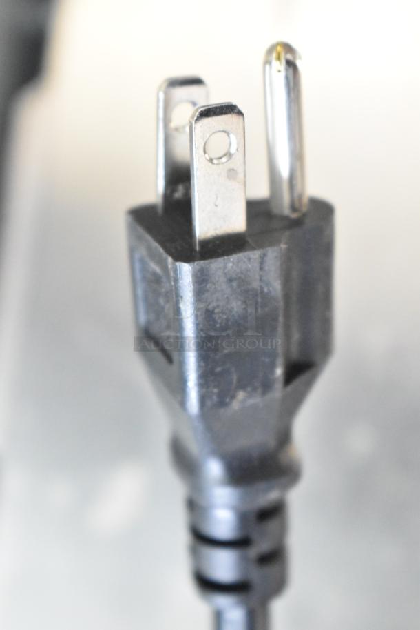 Close-up of a three-prong power plug for the Avantco 178SS1RHC reach-in cooler, 115V, 1 phase, in good condition.