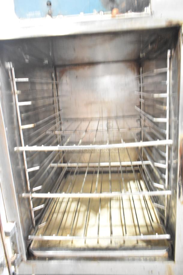 Alto Shaam 1000-TH Halo Heat full-height commercial oven, stainless steel, on casters, internal racks visible.