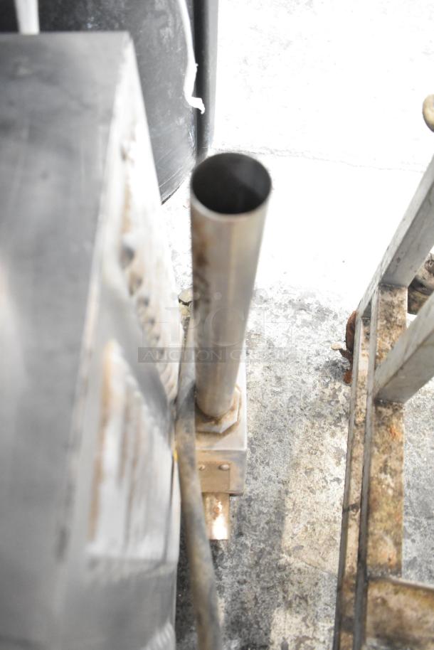 Groen HY-3E stainless steel steam cabinet, single deck, electric, 240V, 3 phase. Seen from the side, showing metal piping and surface.