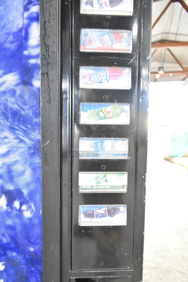 Metal commercial bottle vending machine with visible drink selections. Operates on 115 volts, 1 phase.