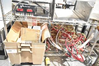 Tier lot with various items including kegerator hoses, couplers, boxes, and a Pro-Max grill timer. Mixed condition.