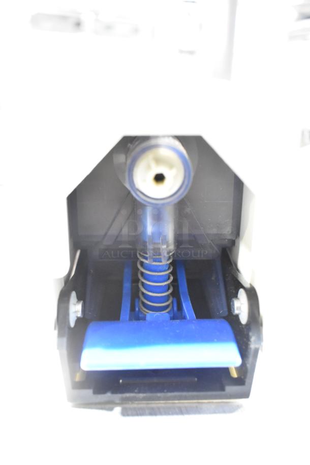 Kegerator coupler with blue lever and spring mechanism, part of an auction lot including hoses.