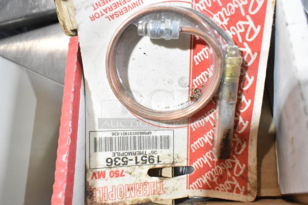 Tier lot featuring kegerator hose and coupler on a marked Thermopile packaging, showing some wear.