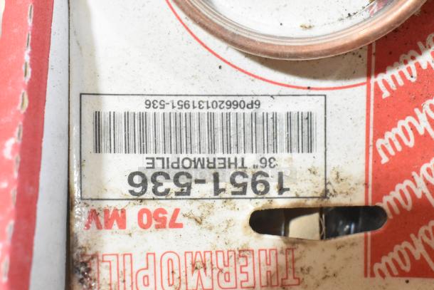 Close-up of a dirty label showing part number 1951-536 for a Thermopile 750 MV. Visible barcode and packaging detail.