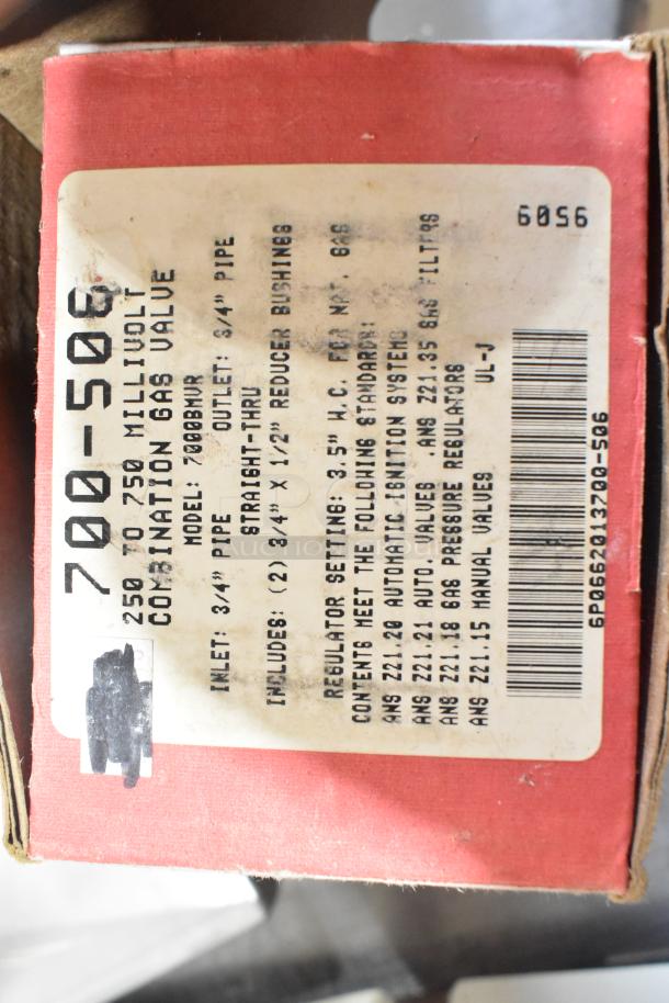 Box with label reading "700-506 Millivolt Combination Gas Valve," model 7000BMR, inlet 3/4", outlet 3/4". Red packaging.