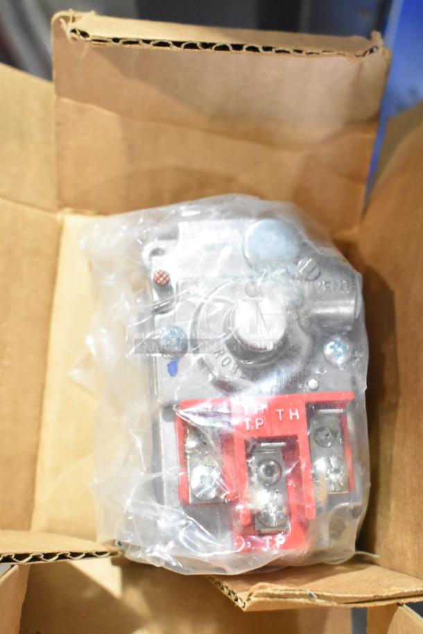Boxed component from a tier lot including kegerator hoses, wrapped in clear plastic, with visible metal fittings and red labeled connectors.