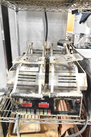 Star Pro Max Stainless Steel Commercial Countertop Double Panini Press with dual controls, visible wear, and operational labels.