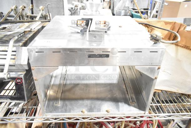 Metal commercial countertop warmer, 115 volts, 1 phase, silver with "Caution: Hot" label, moderate wear.