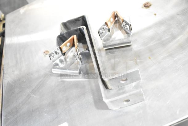 Metal commercial countertop warmer, dual bracket design, 115 volts, 1 phase, in used condition with visible wear.