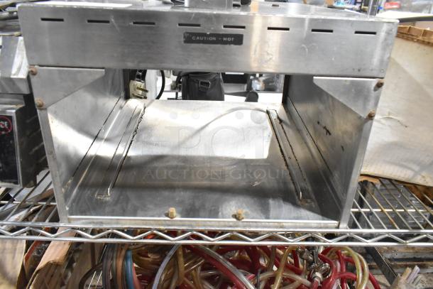 Metal commercial countertop warmer, 115 volts, 1 phase. Used condition, visible "Caution - Hot" label.