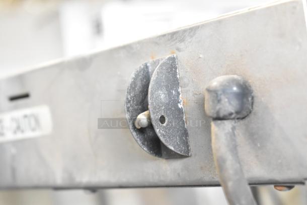 Metal countertop warmer, used condition, with visible dial and wear, 115 volts, 1 phase.