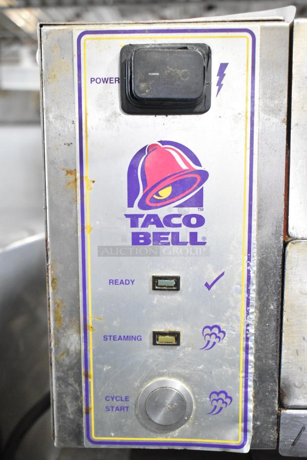 Roundup stainless steel Taco Bell food steamer, 208 volts, 1 phase. Features power, ready, and steaming indicators. Used condition.