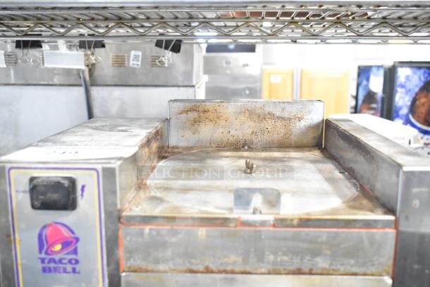 Roundup Stainless Steel Commercial Countertop Taco Bell Food Steamer, 208 Volts, 1 Phase, shows signs of use.