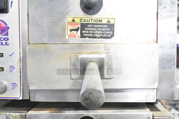 Roundup Stainless Steel Commercial Countertop Food Steamer for Taco Bell, 208V, 1 Phase. Caution label for hot surfaces visible.