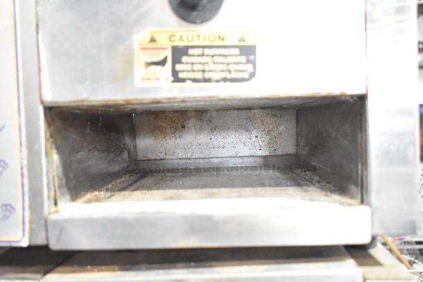 Roundup stainless steel commercial countertop Taco Bell food steamer, 208 volts, 1 phase, used condition with caution label.