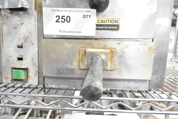 Roundup TBS-1X commercial stainless steel Taco Bell food steamer, 208V, 1 phase; visible wear and caution label.