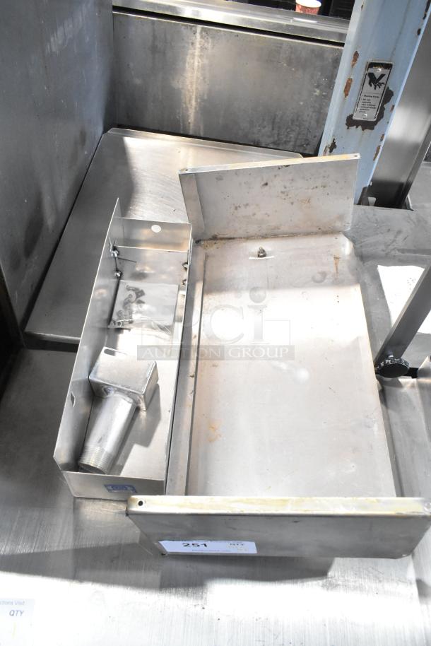 Various metal items including a cup dispenser and fry basket. Used condition with visible wear. Auction tag number 251.