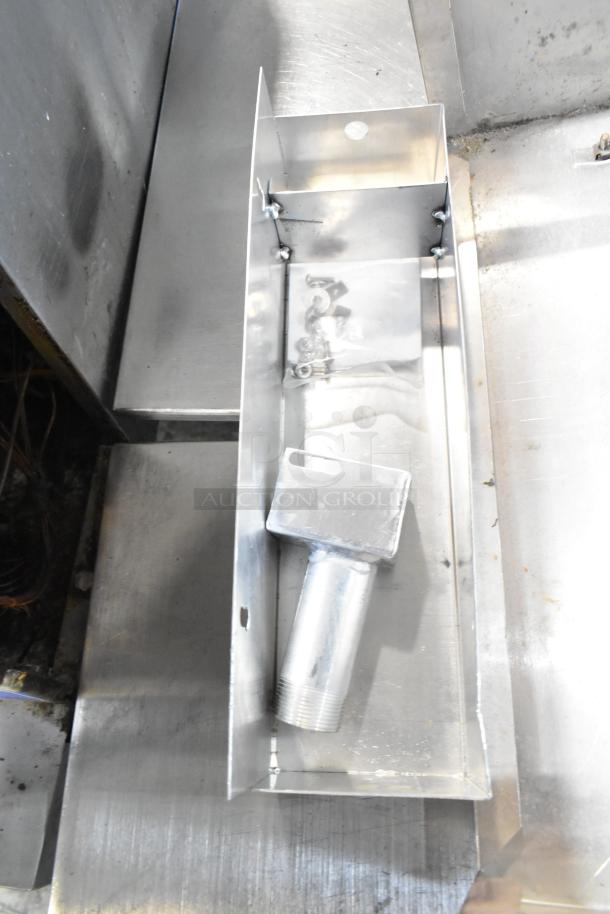 Assorted metal items including cup dispenser and fry basket in used condition. Metal pieces visible in lot.