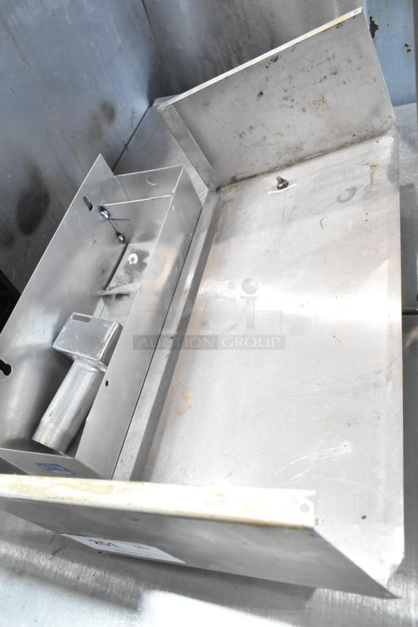 Auction lot with metal cup dispenser, fry basket, and metal pieces in used condition. Includes mounting hardware.