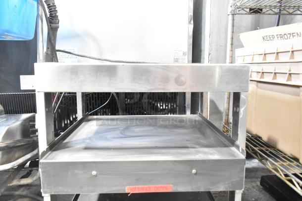 Stainless steel commercial countertop 2-tier warmer, 115 volts, 1 phase, with "Hot Surface - Caution" label shown.