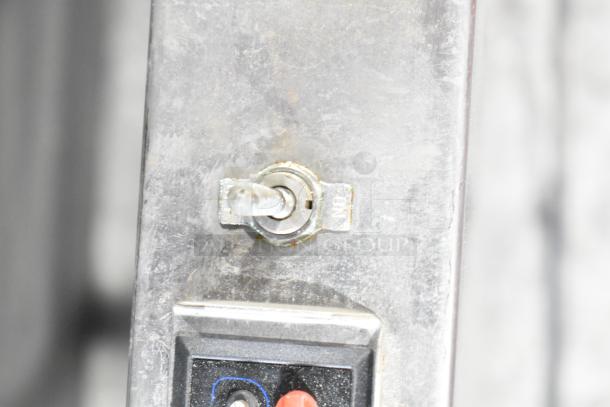 Stainless steel commercial countertop 2 tier warmer, 115 volts, 1 phase, features a metal toggle switch, in used condition.