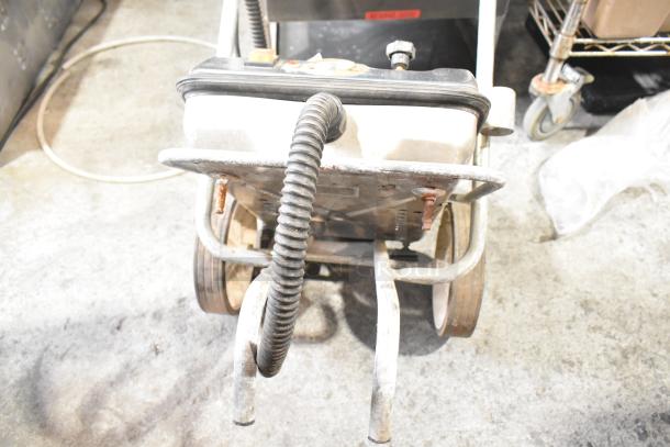 Robby VS3000 Metal Commercial Dry Steam Cleaner, 115 Volts, 1 Phase, visible wear, sturdy metal frame, flexible hose.