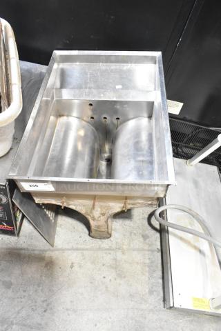 Stainless steel unit with dual trough, used condition, rust on base, tagged "256".