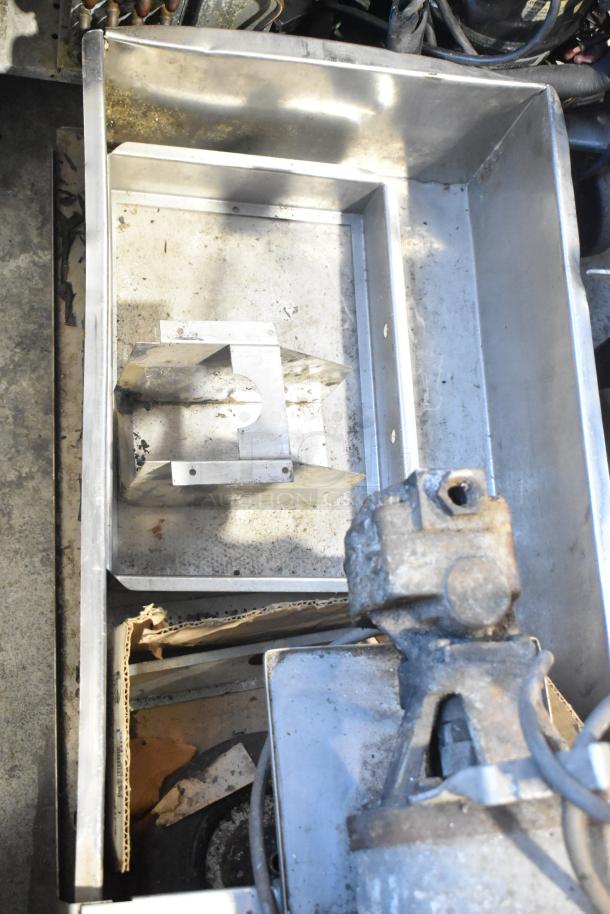 CCF-16-W metal commercial portable shortening filter machine, shows signs of use, on commercial casters for mobility.