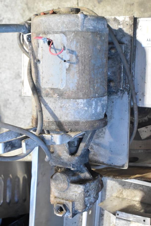 CCF-16-W metal commercial portable shortening filter machine, worn condition, visible wiring, mounted on commercial casters.