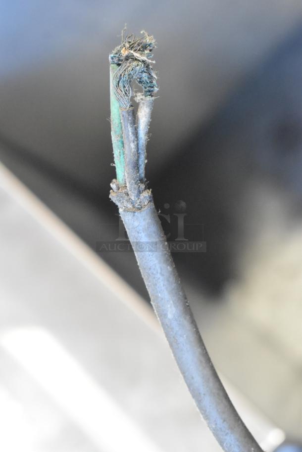 Close-up of a damaged power cord for CCF-16-W Metal Commercial Portable Shortening Filter Machine, showing exposed wiring.