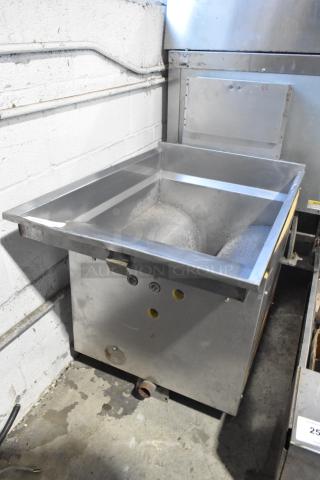 Metal commercial fryer frame, stainless steel, with mounting brackets and pipe fittings, in used condition.