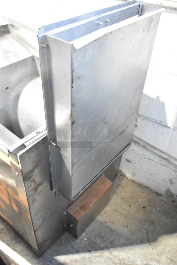 Metal commercial fryer frame, stainless steel, industrial-grade, slight wear and rust on edges, suitable for repair or replacement.