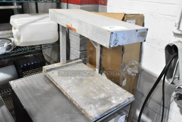 Metal countertop heat strip warmer, 115 volts, 1 phase, used condition with visible wear, ideal for food service.