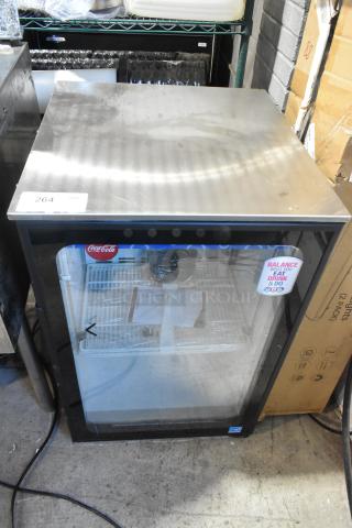 Imbera EVC04 metal mini cooler merchandiser, 115 volts, 1 phase. Features Coca-Cola branding on glass. Good condition.